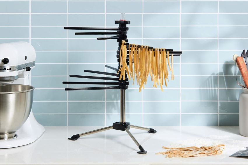 KitchenAid KPDR Pasta Drying Rack on countertop with fresh pasta hanging