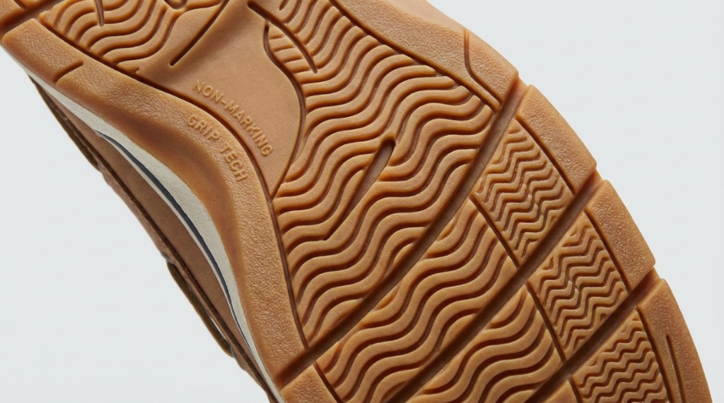 Close-up of high-traction rubber tread pattern on a boat shoe outsole.