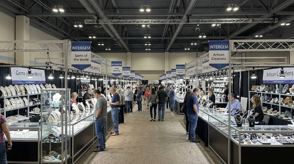 Rows of gem and jewelry vendor booths at the San Mateo County Event Center during the InterGem show